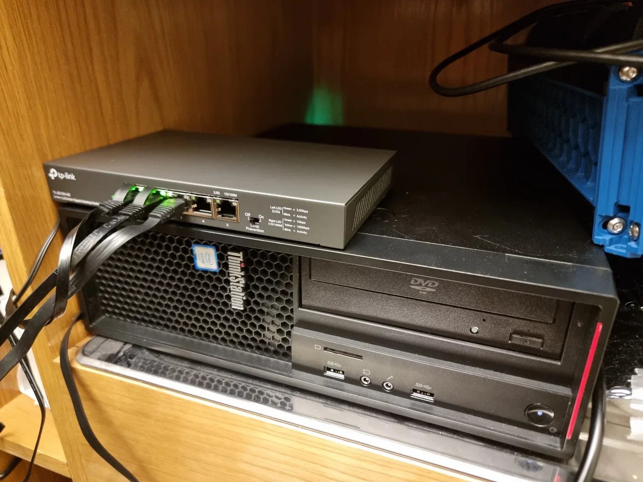 Lenovo ThinkStation home server with the network switch mounted above it
