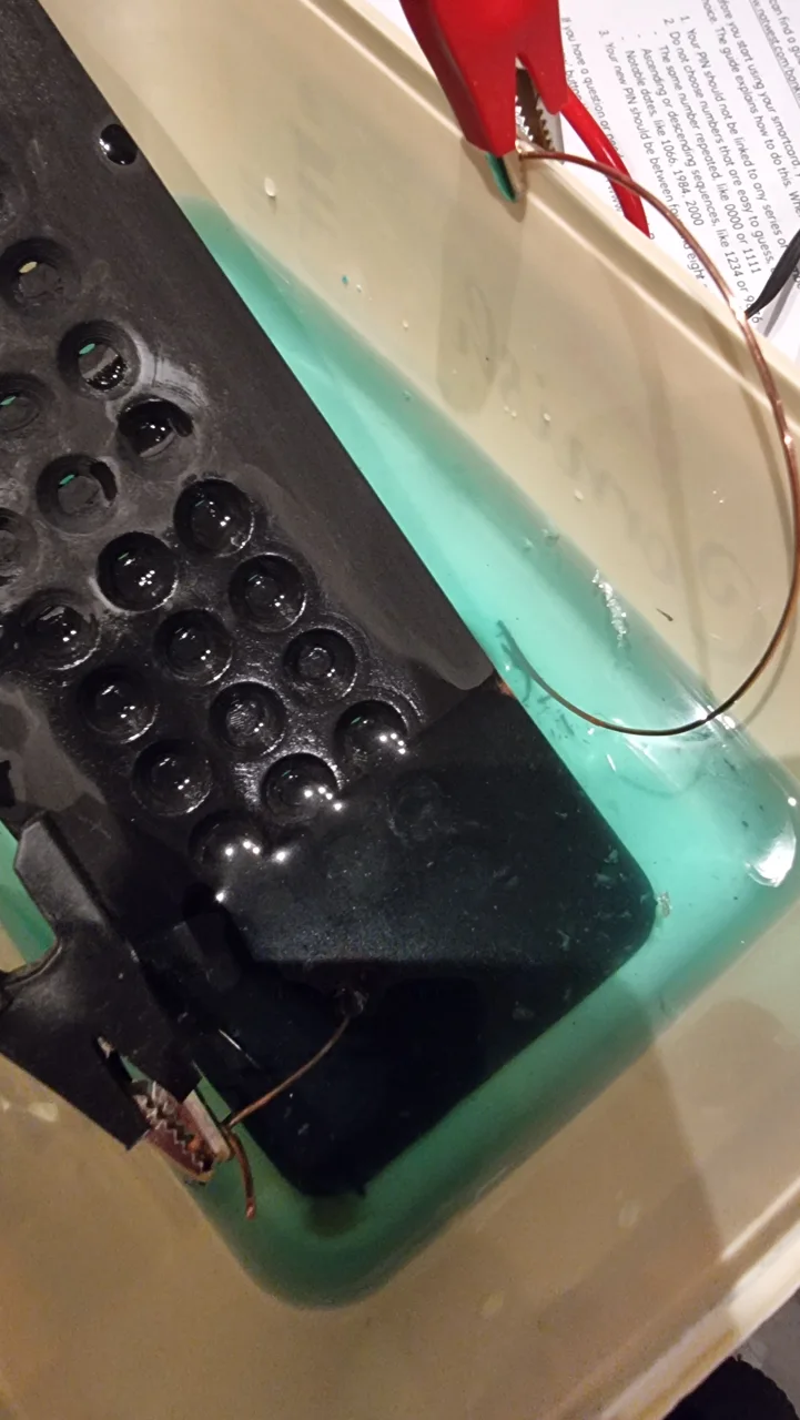 Printed pedal face submerged in the copper electroplating bath